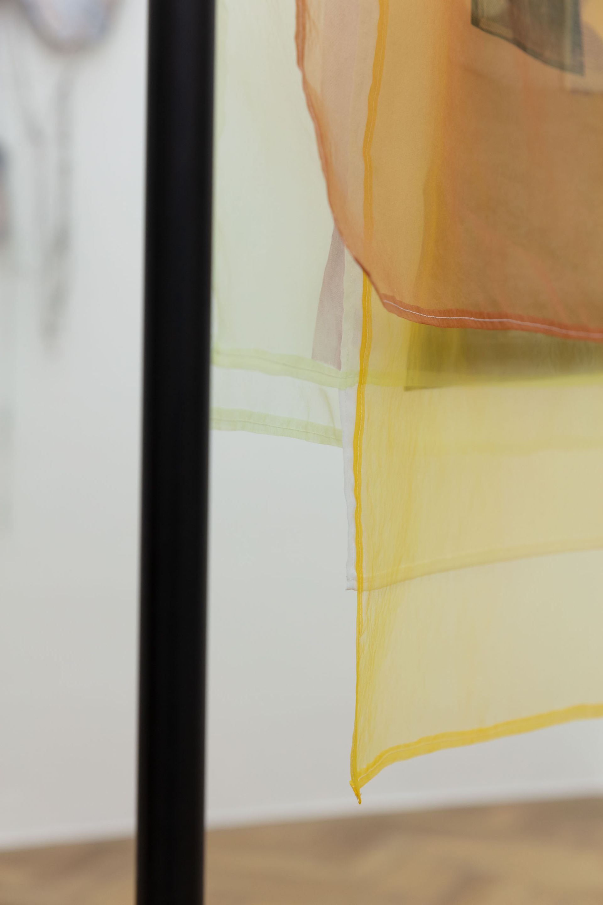 Ana Navas, Lines under a tangerine light, 2021, Silkscreen on translucent textile and metal stand, 186 × 103 × 35 cm
