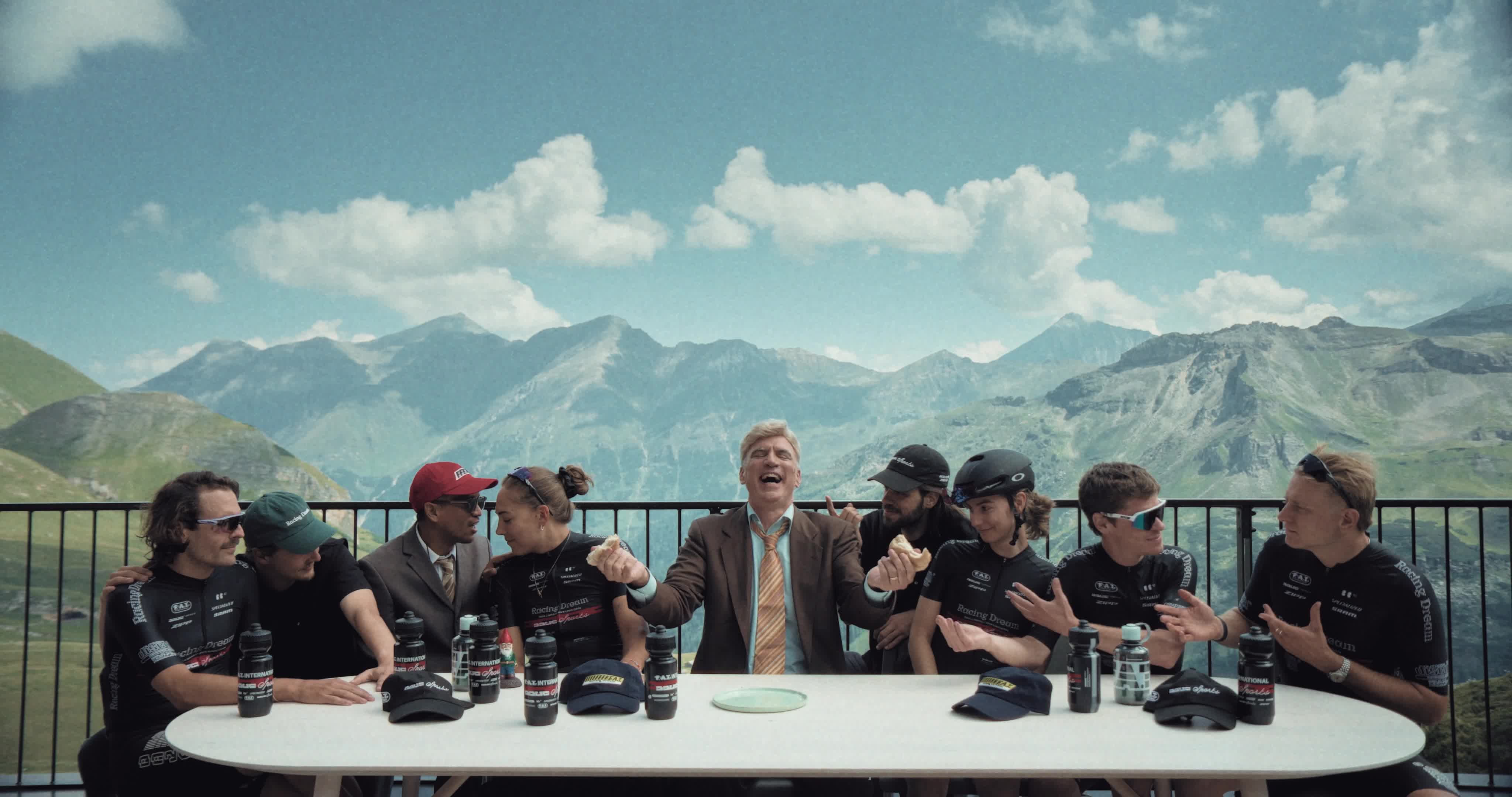 the giro team break bread on top of the mountain