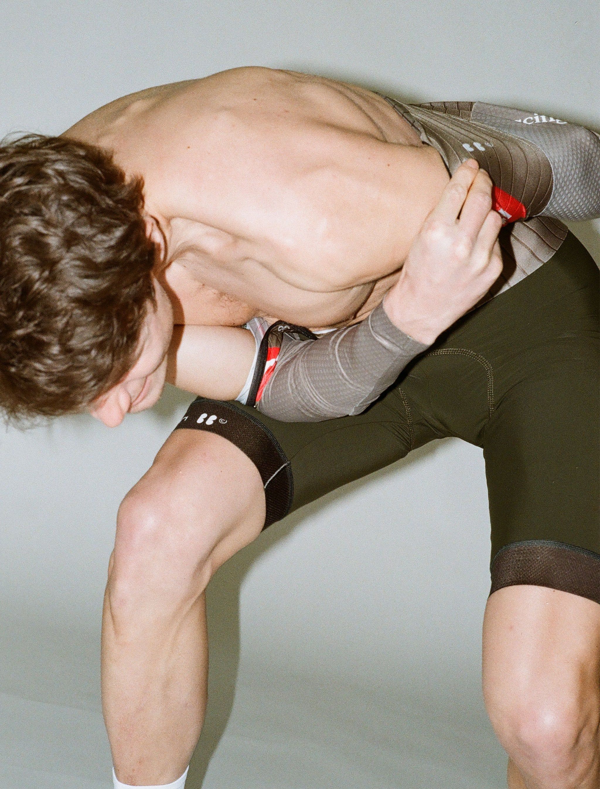 flash picture of stephan awkwardly getting into the olive racing dream skinsuit
