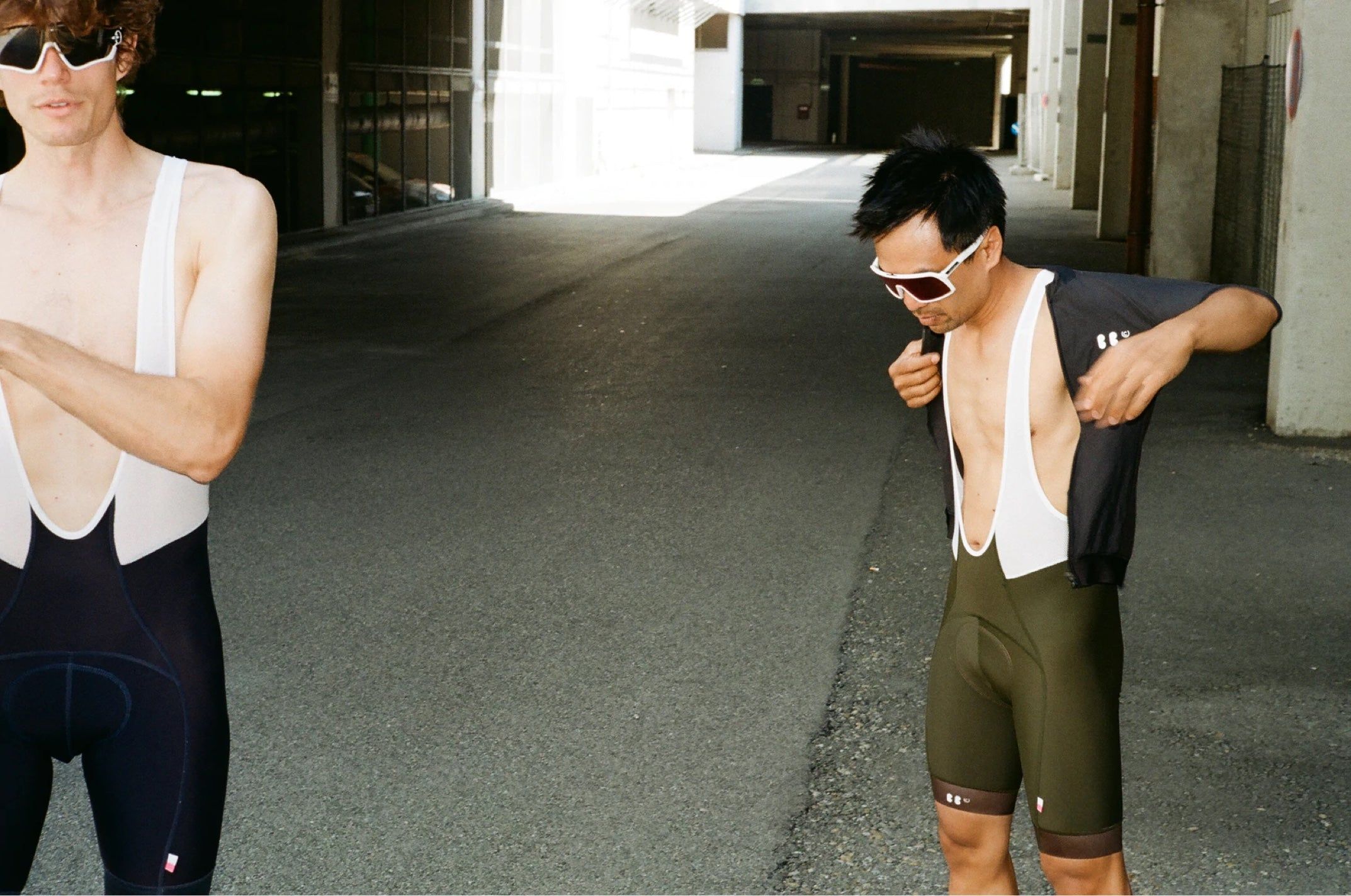 stephan and marvin getting dressed in a parking lot