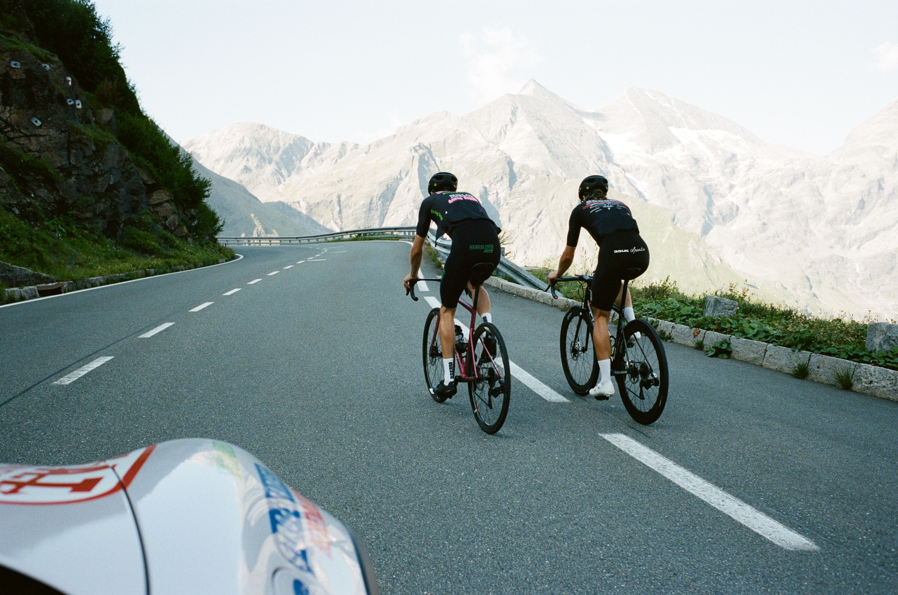 joe and adam from the team as seen from the team car, somewhere on the mountain