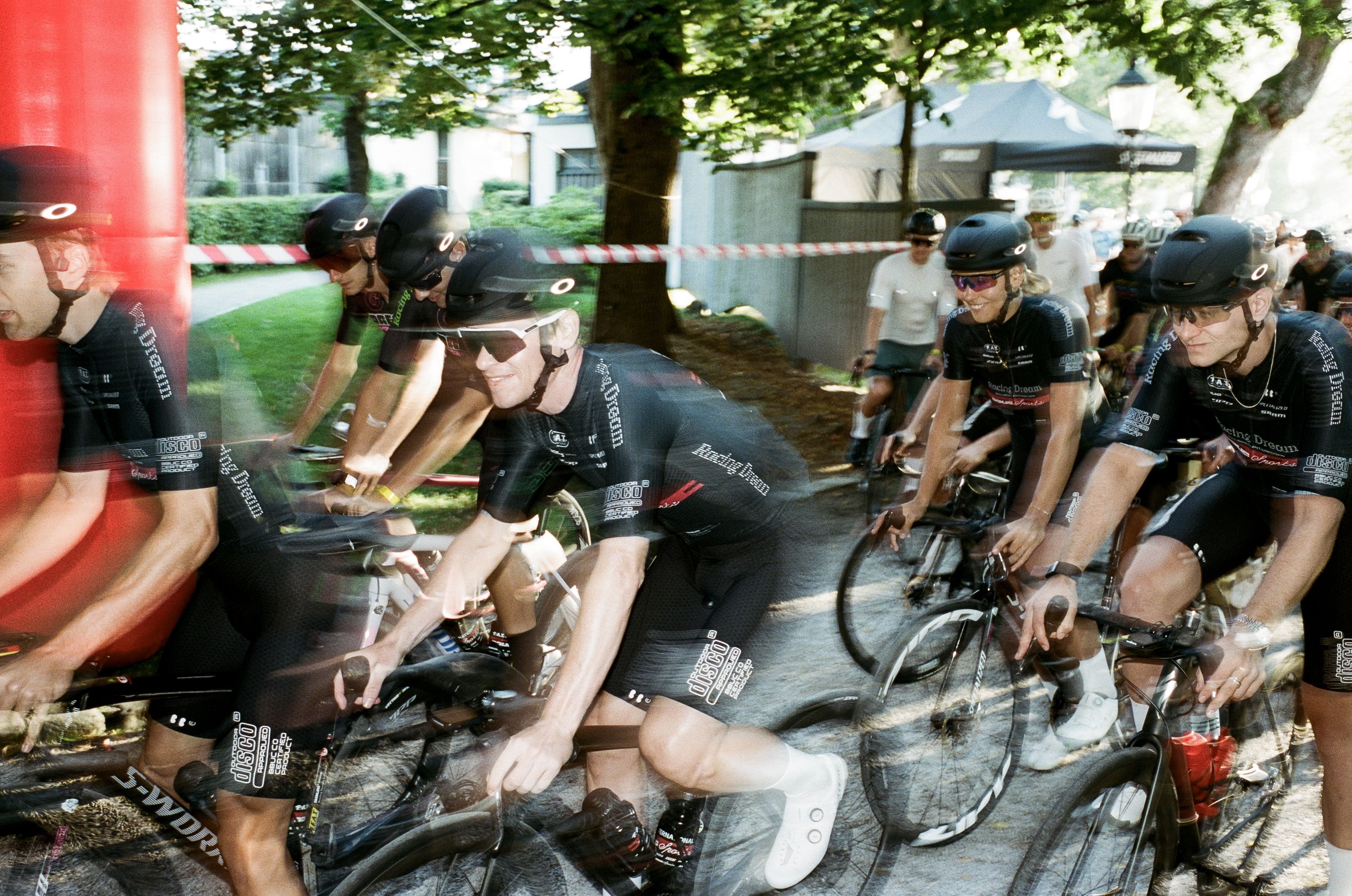 riders at the start line leaving in a blur