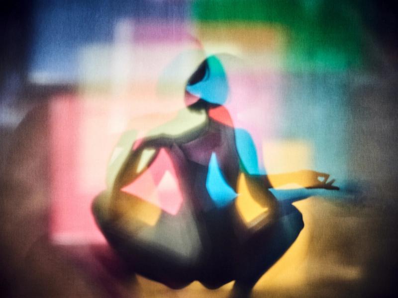 Michael Haegele abstract photography overlapping silhouette squatting woman with short hair and colourful squares in the background
