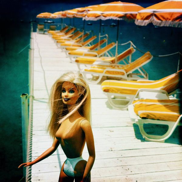 Delia Dickmann Photography Nude Blonde Barbie On A Jetty With Yellow Sunbeds