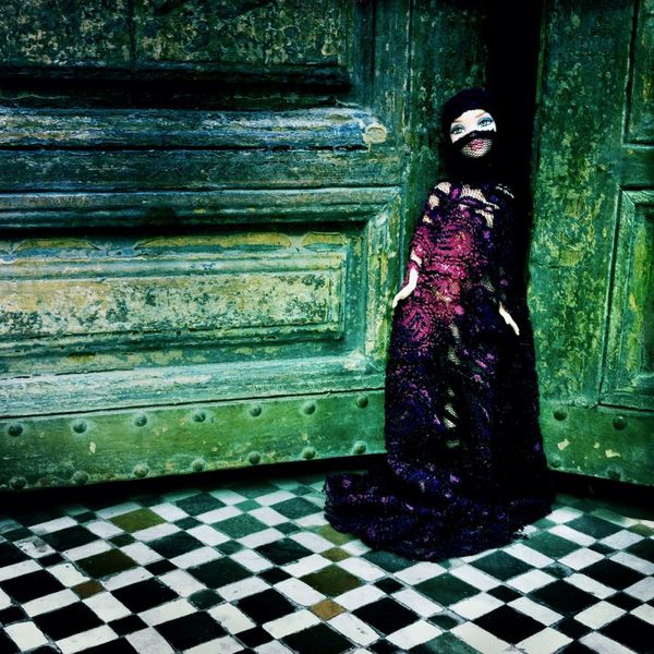 Delia Dickmann Photography Covered Barbie in Dress and Veil on Checkered Floor and Green Door