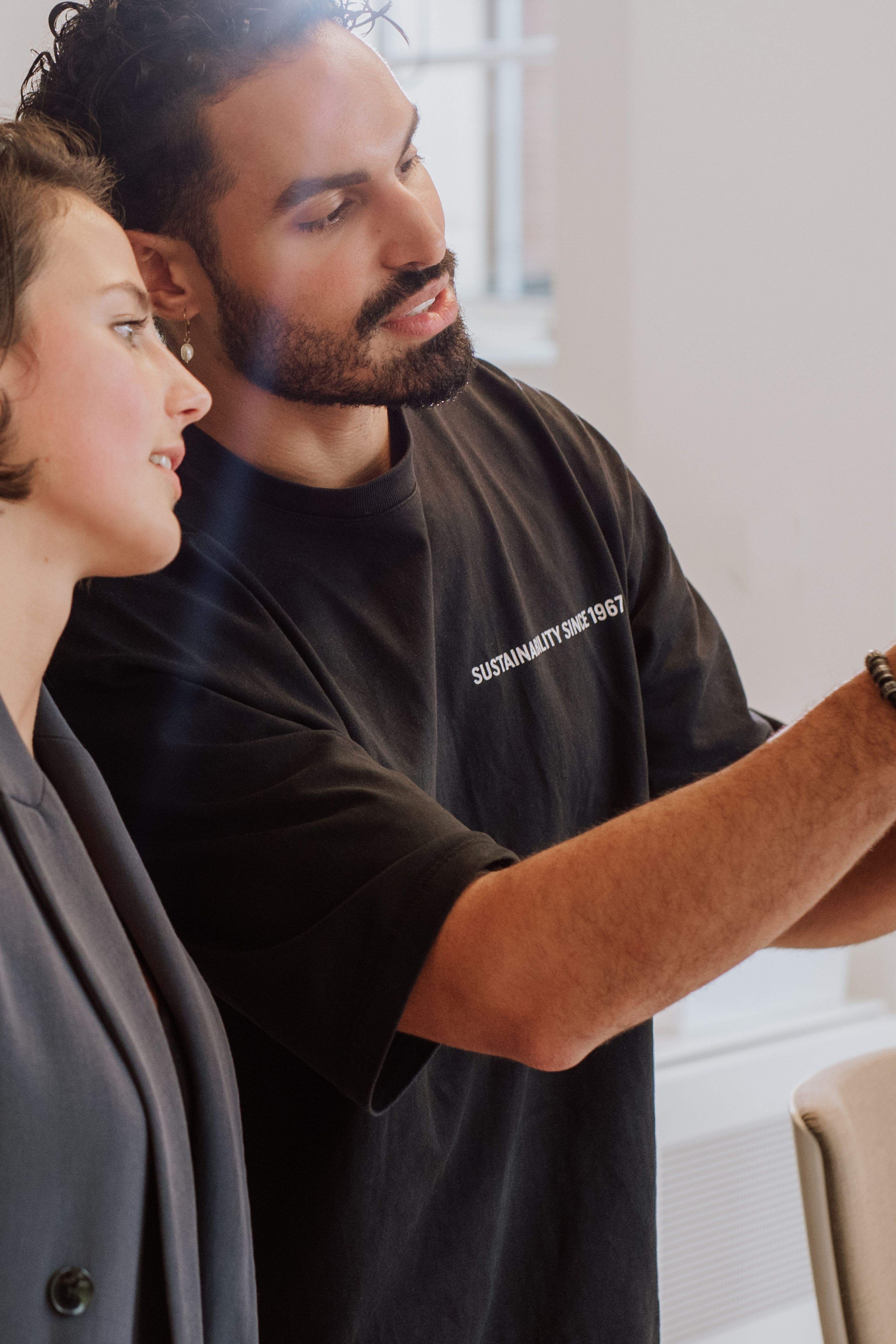 Two employees looking at a product