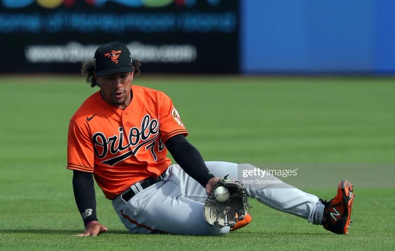 Jahmai Jones slides in grass for the ball