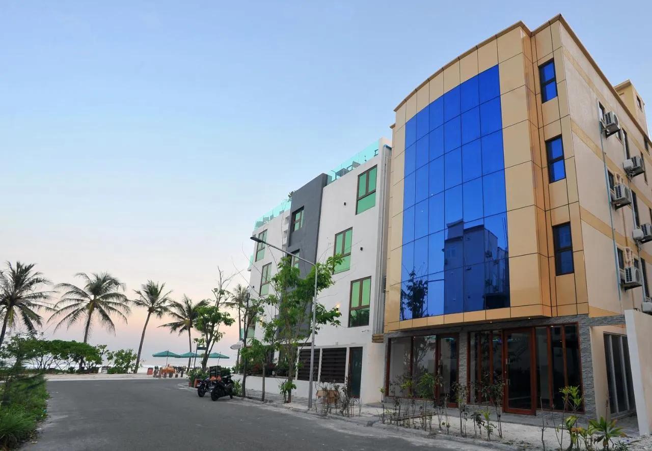Turquoise Residence by UI building beside the beach and palm trees in Hulhumalé, a short walk from Hulhumalé Beach.