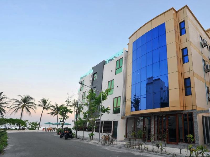 Turquoise Residence by UI building beside the beach and palm trees in Hulhumalé, a short walk from Hulhumalé Beach.