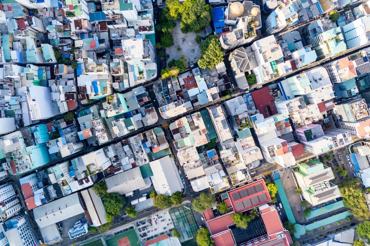 Top-down drone view of Malé streets and tightly packed buildings
