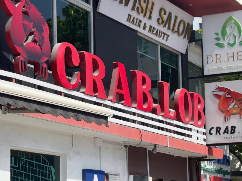 Storefront sign of Crab.Lob in Malé