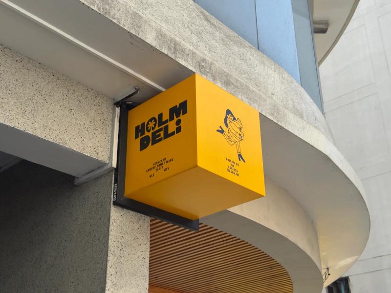 Sign of HOLM Deli on Ameeru Ahmed Magu in Malé