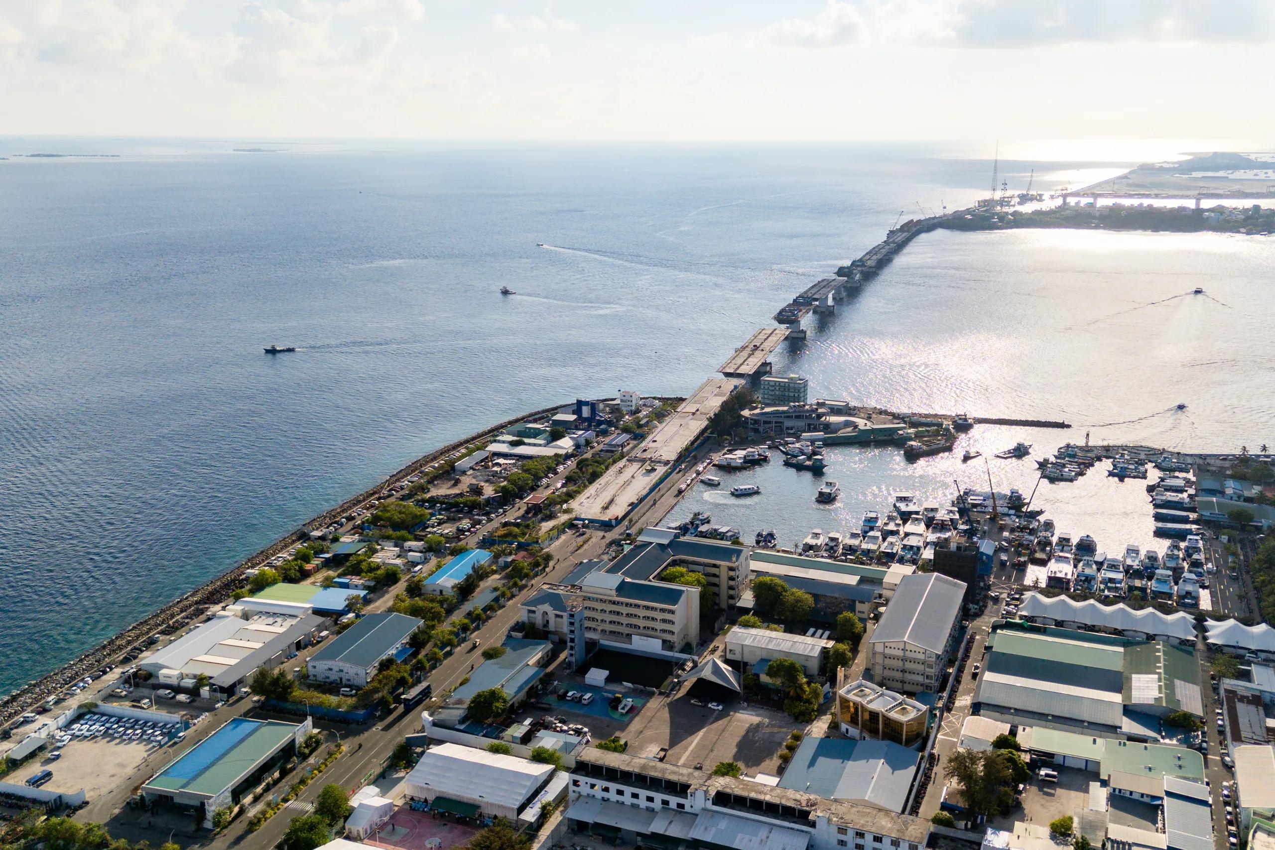 The under-construction Thilamalé Bridge reaching across the water from Malé