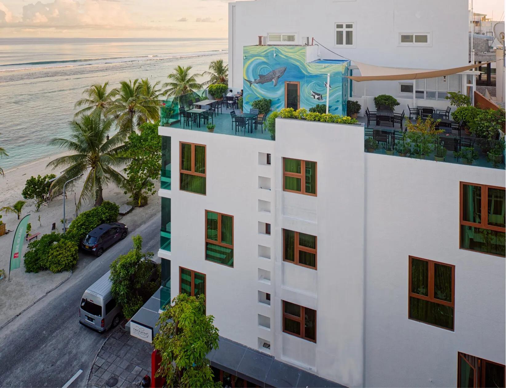 White H78 Maldives building with a whale shark mural and rooftop terrace, steps from the beach in Hulhumalé.