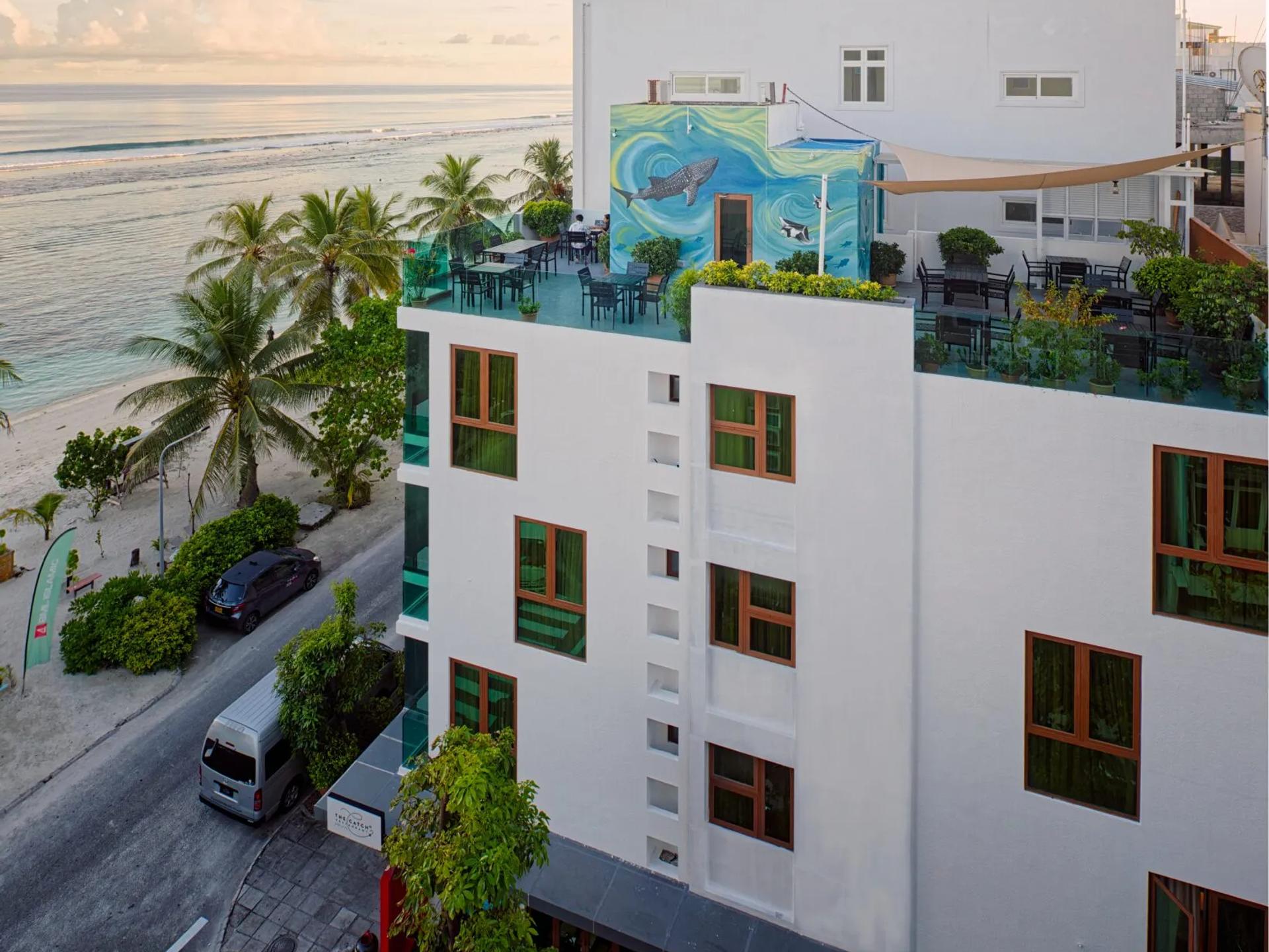 White H78 Maldives building with a whale shark mural and rooftop terrace, steps from the beach in Hulhumalé.