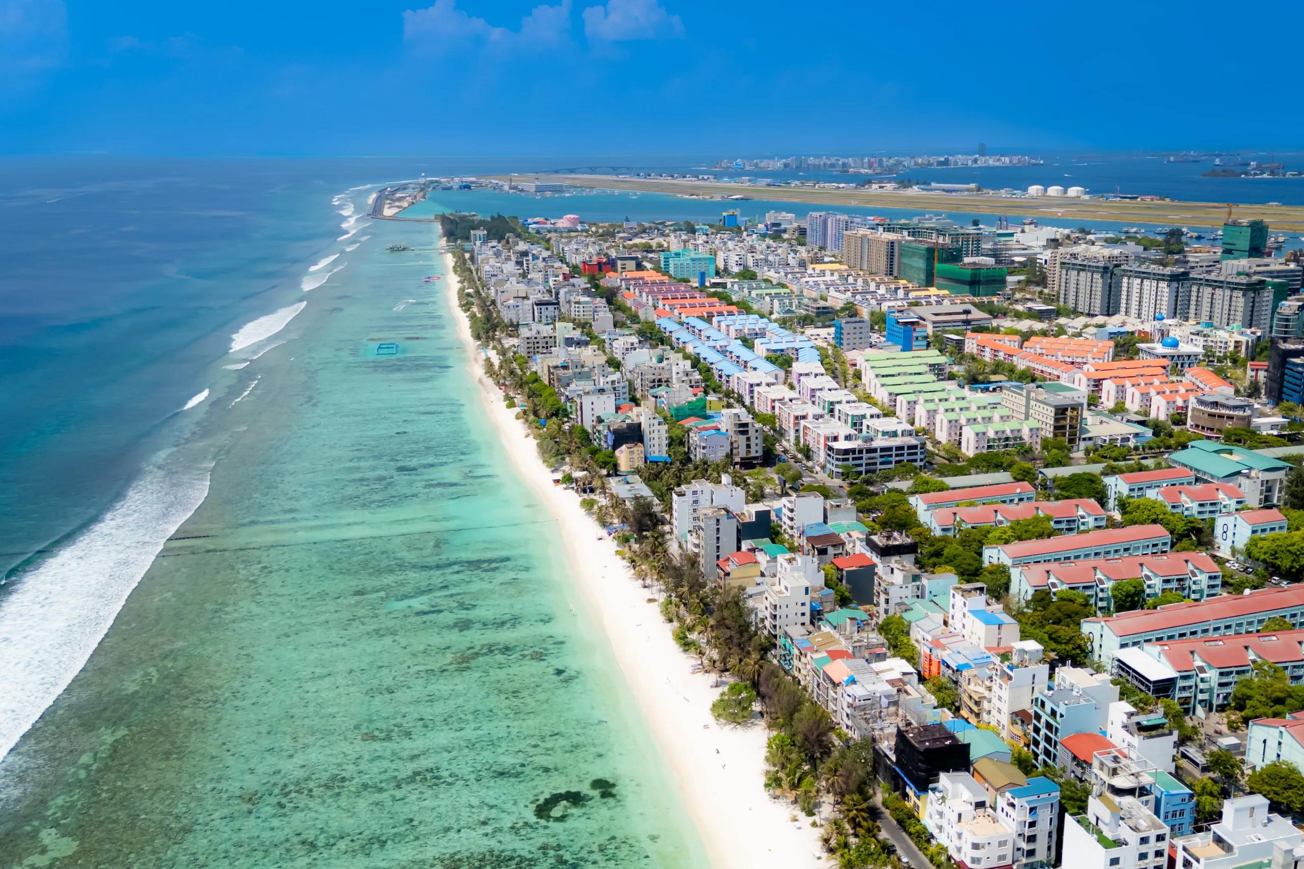 Aerial view down the length of Hulhumalé with the public beach running along the shore