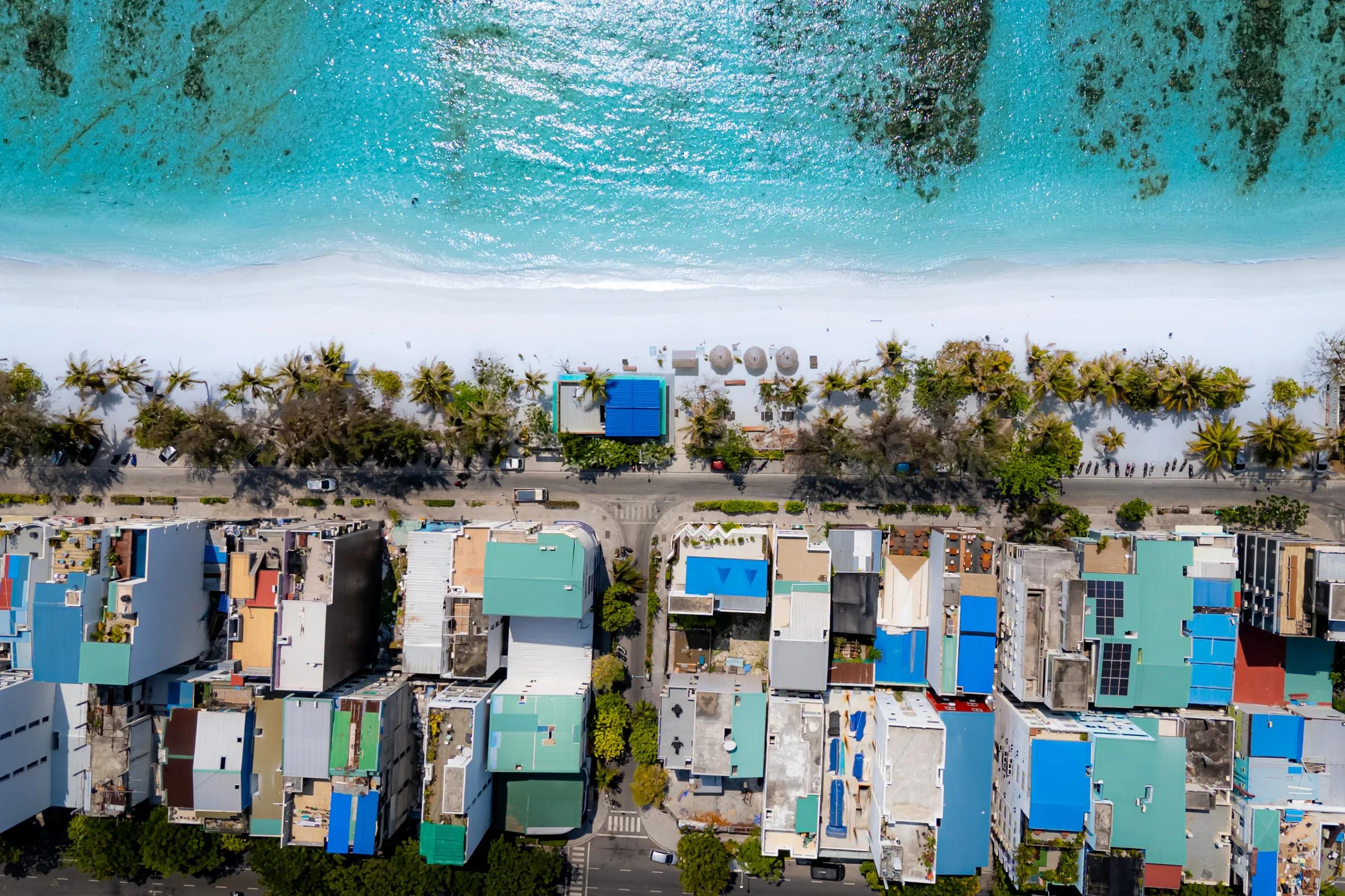 Top-down drone view of the beach and houses on Hulhumalé's eastern shore