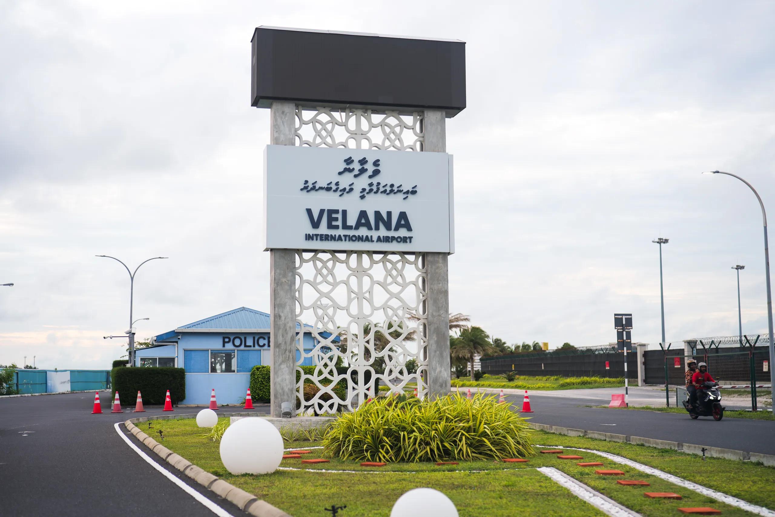 Velana International Airport sign at the terminal entrance