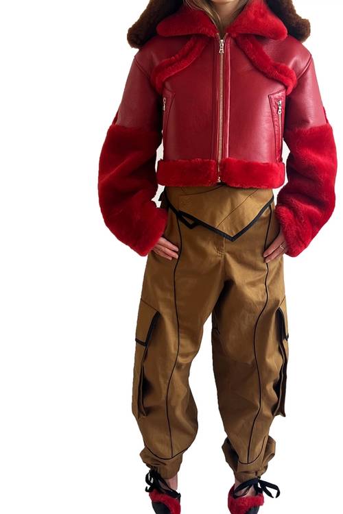Motion | Phoebe Mahoney | Cherry red sheepskin coat and Cargo trousers with contrast curved binding detail.