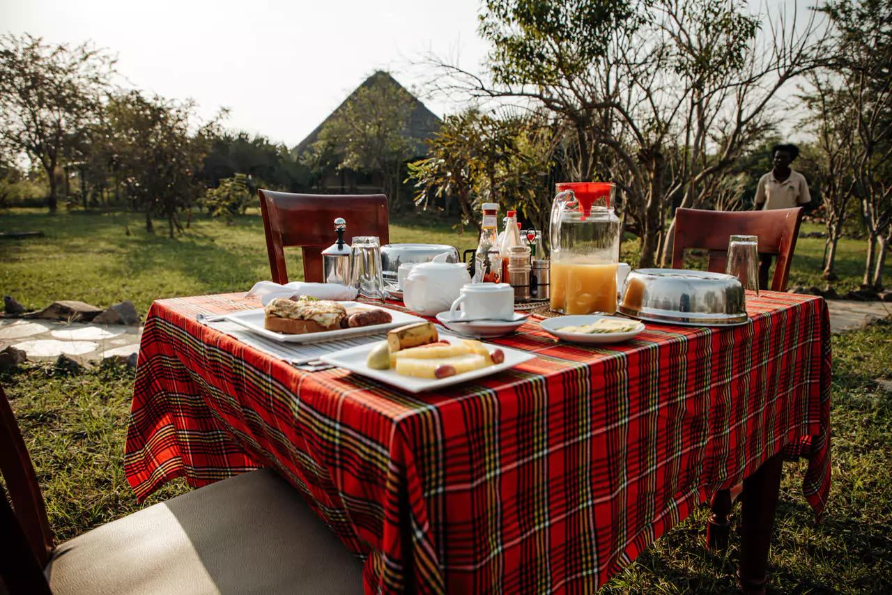 Breakfast laid out on a table in the open
