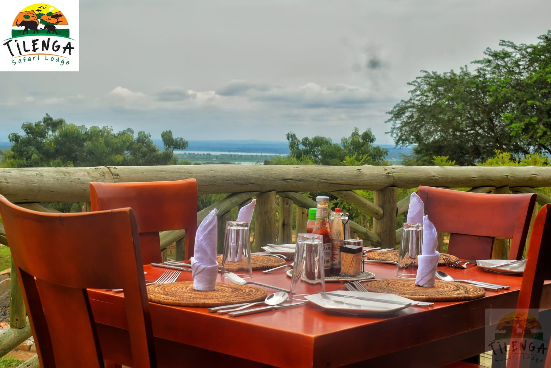 A laid table on the deck looking out over the water