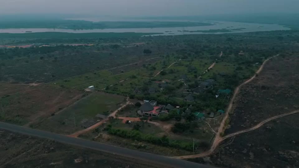Aerial view of Tilenga Safari Lodge above Murchison Falls National Park at dawn