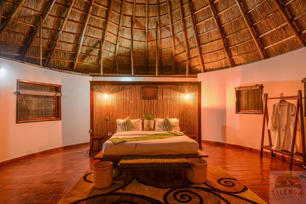 Premium Deluxe Cottage interior beneath a thatched ceiling