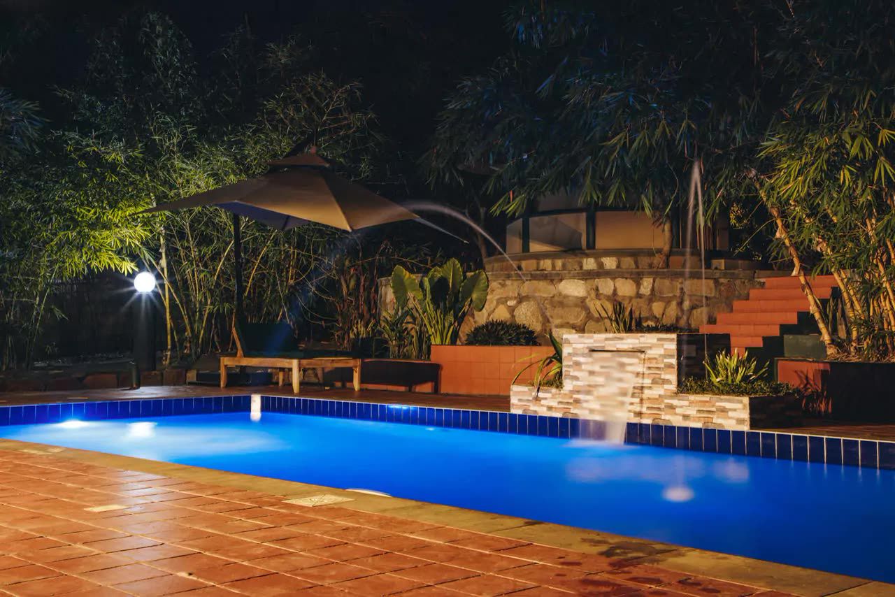 The swimming pool lit at night
