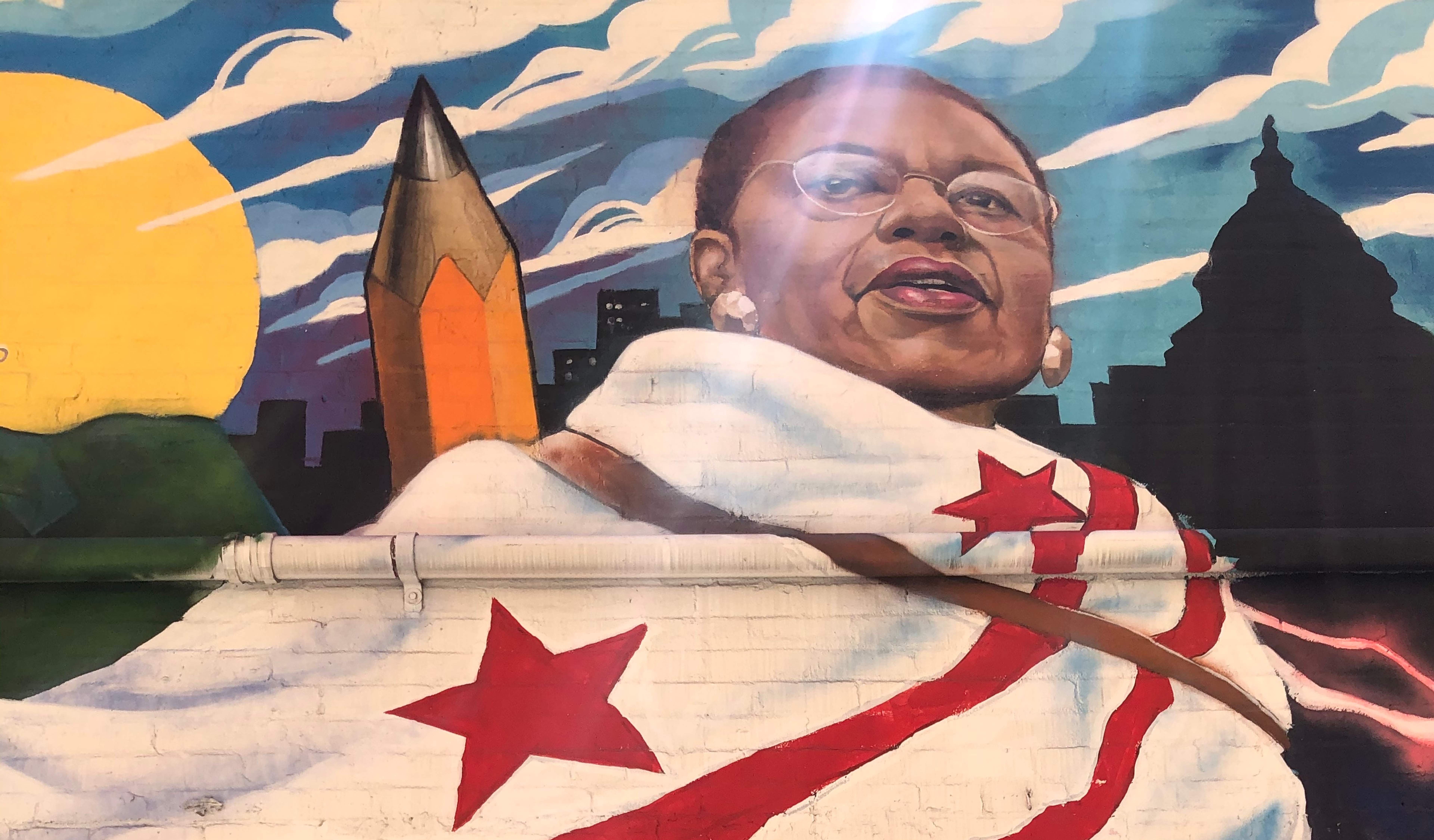 Inspiring mural of Eleanor Holmes Norton with a DC flag wrapped around her