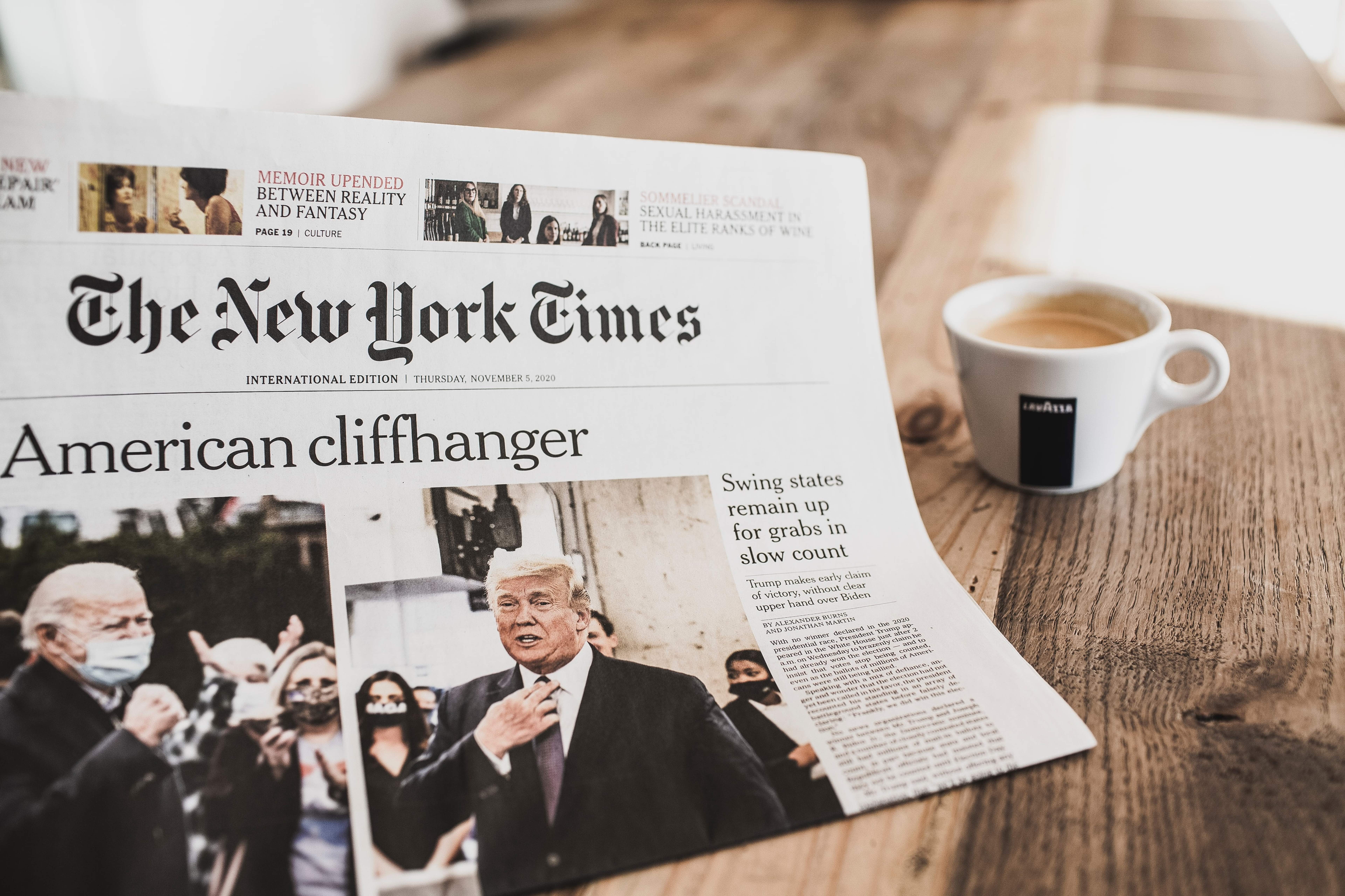 Newspaper with headline "American Cliffhanger"