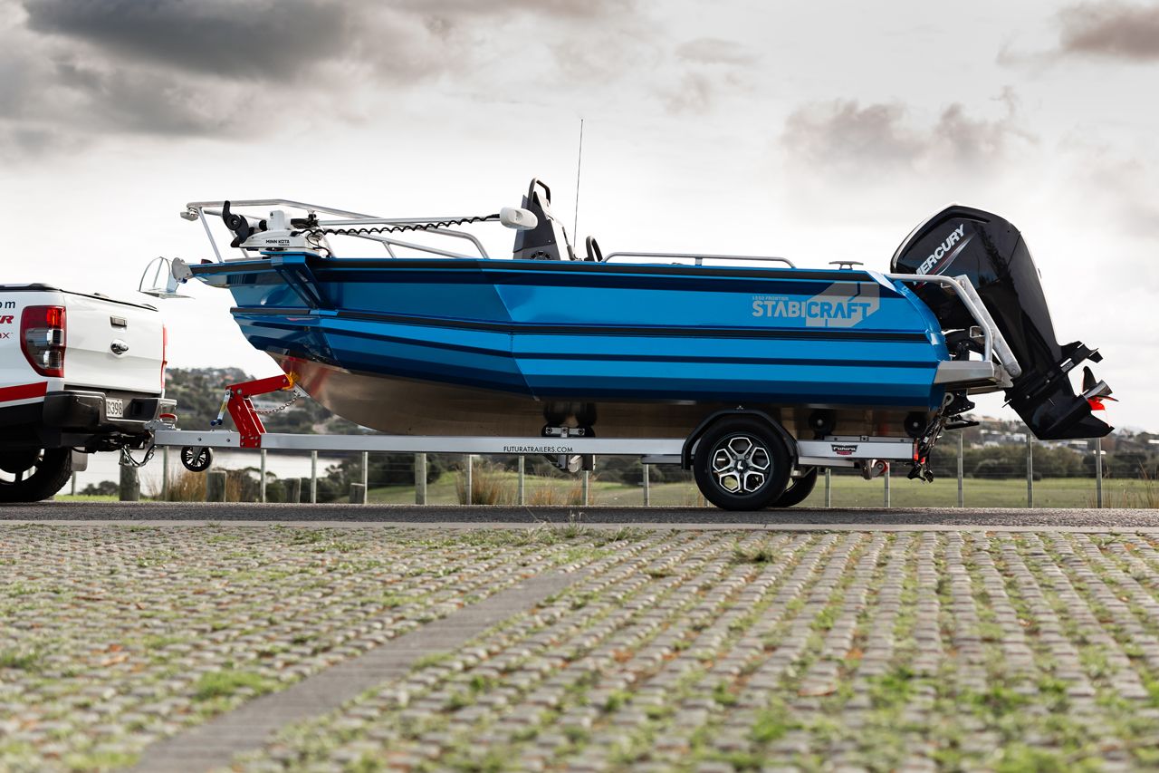 Futura S-475-TRDK Boat Trailer in parking lot near the beach