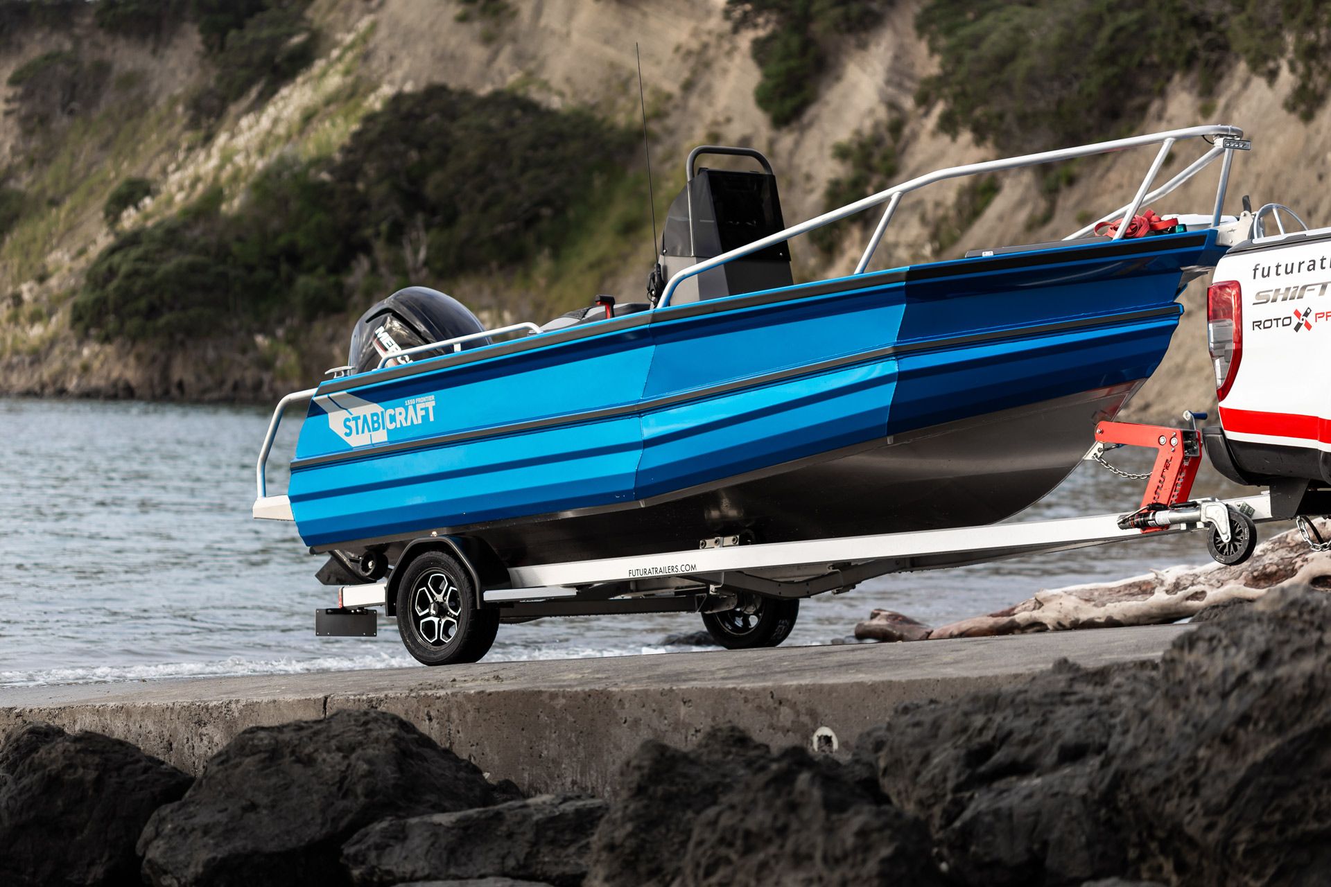 Futura boat trailer unloading Stabicraft boat on boat ramp