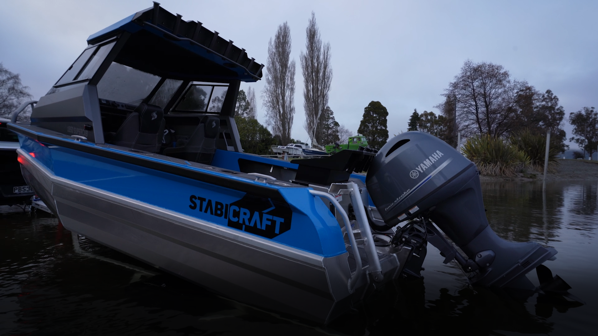 Futura S575-Q3 boat trailer loading Stabicraft boat into the water at a boat ramp in Auckland, New Zealand