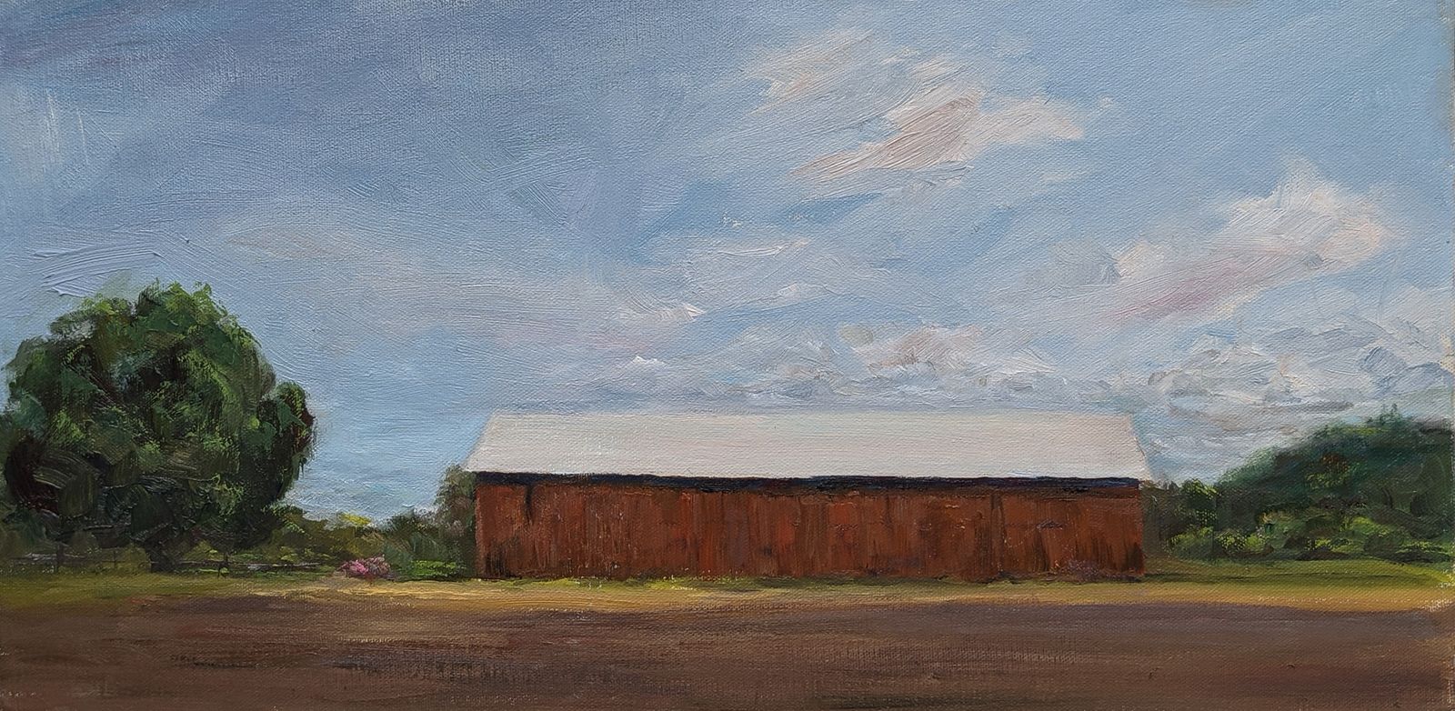 An oil painting of a tobacco barn in early summer.