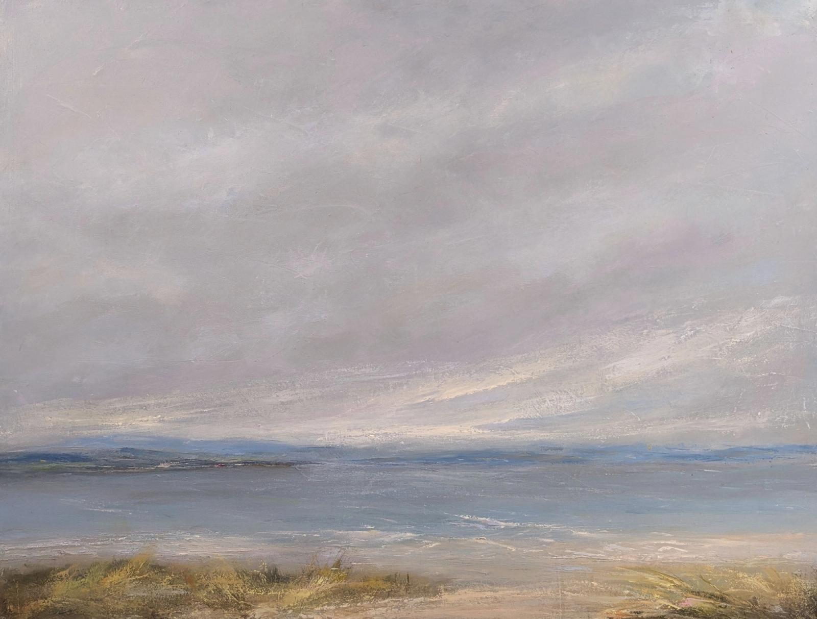 Light breaking on a windy day. Sand dunes with islands beyond.