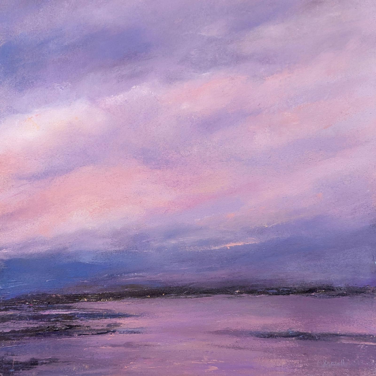 A pink sunset over a distant shore. The whole sky is coloured.