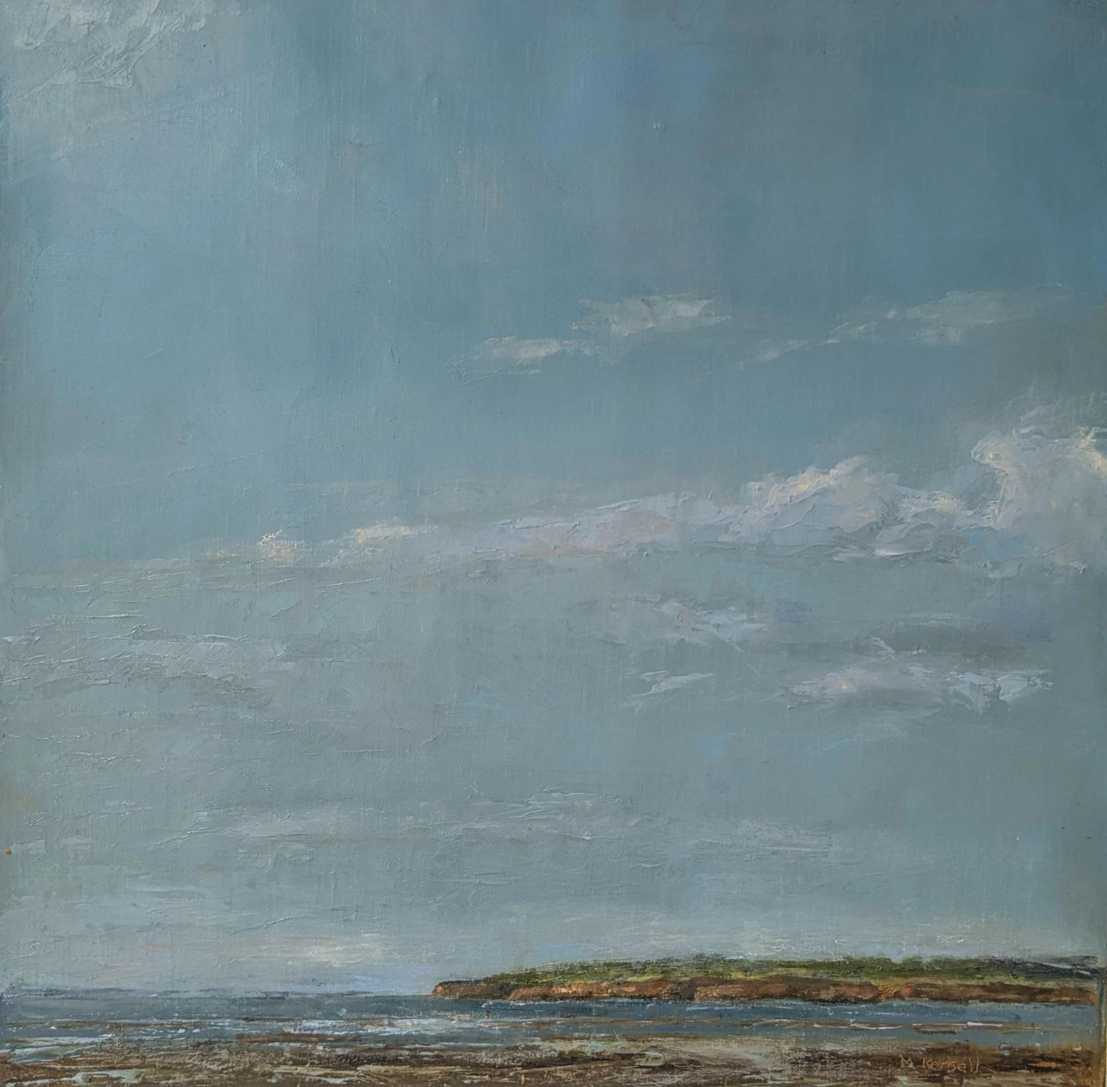 A distant headland, clouds floating above.