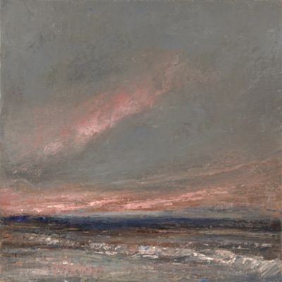 A pink sunset with a dark, stormy sky. Waves washing ashore.