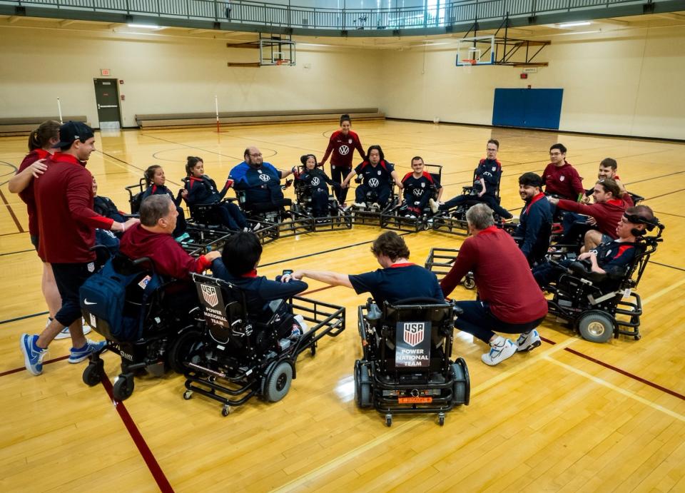 The Power Soccer National Team huddles up on the court