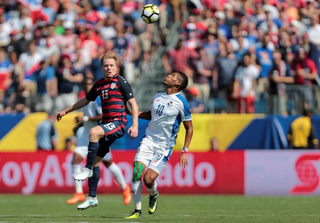 McCarty contests a ball during a USMNT match