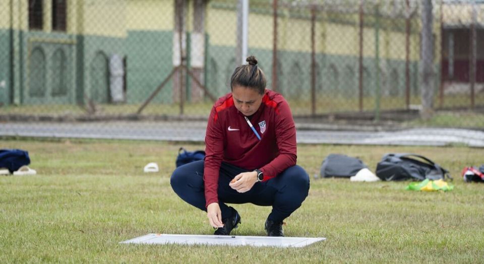 Photo of Vanessa Mann crouched down on the field