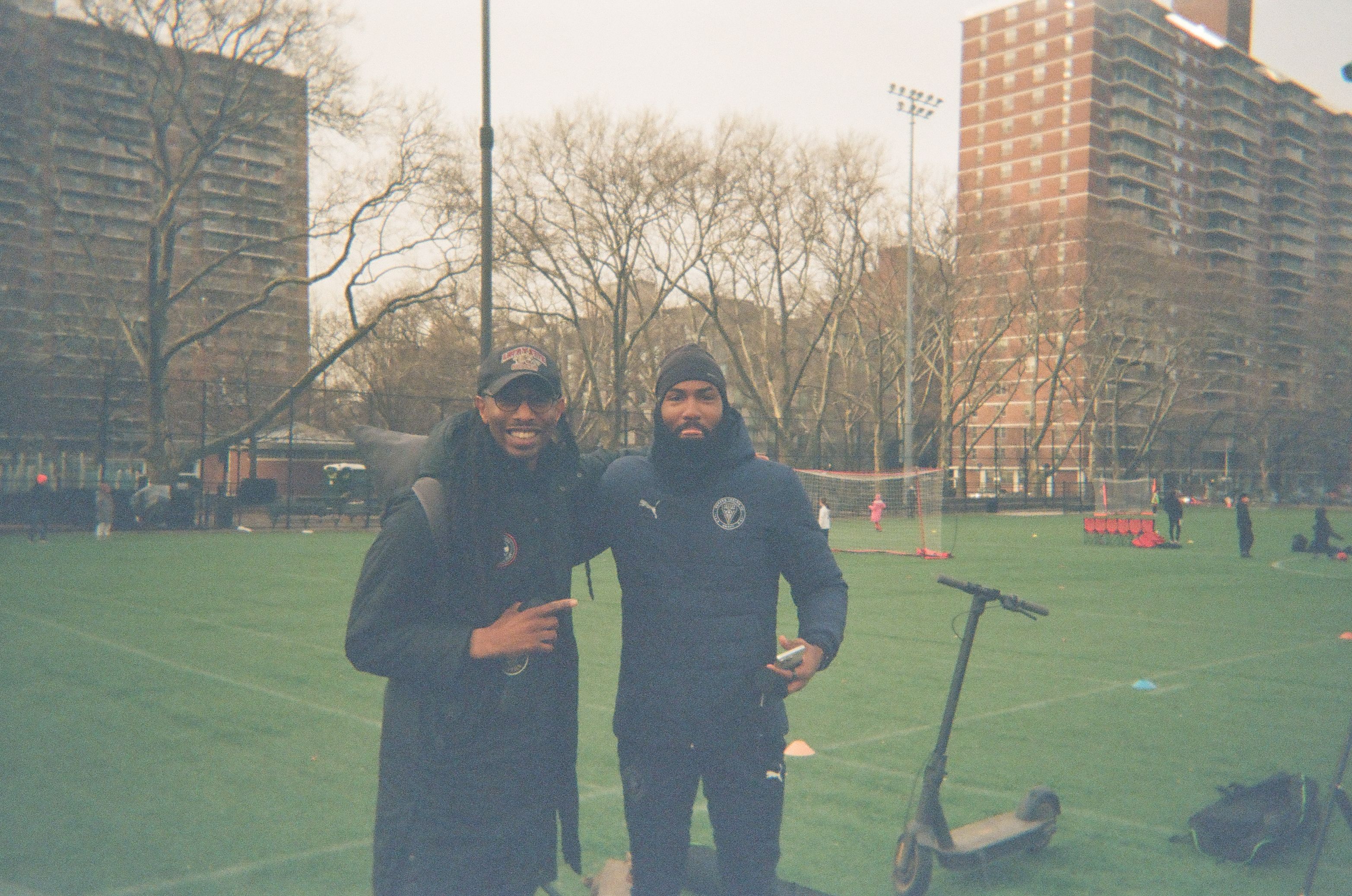 Two coaches posing for a photo.