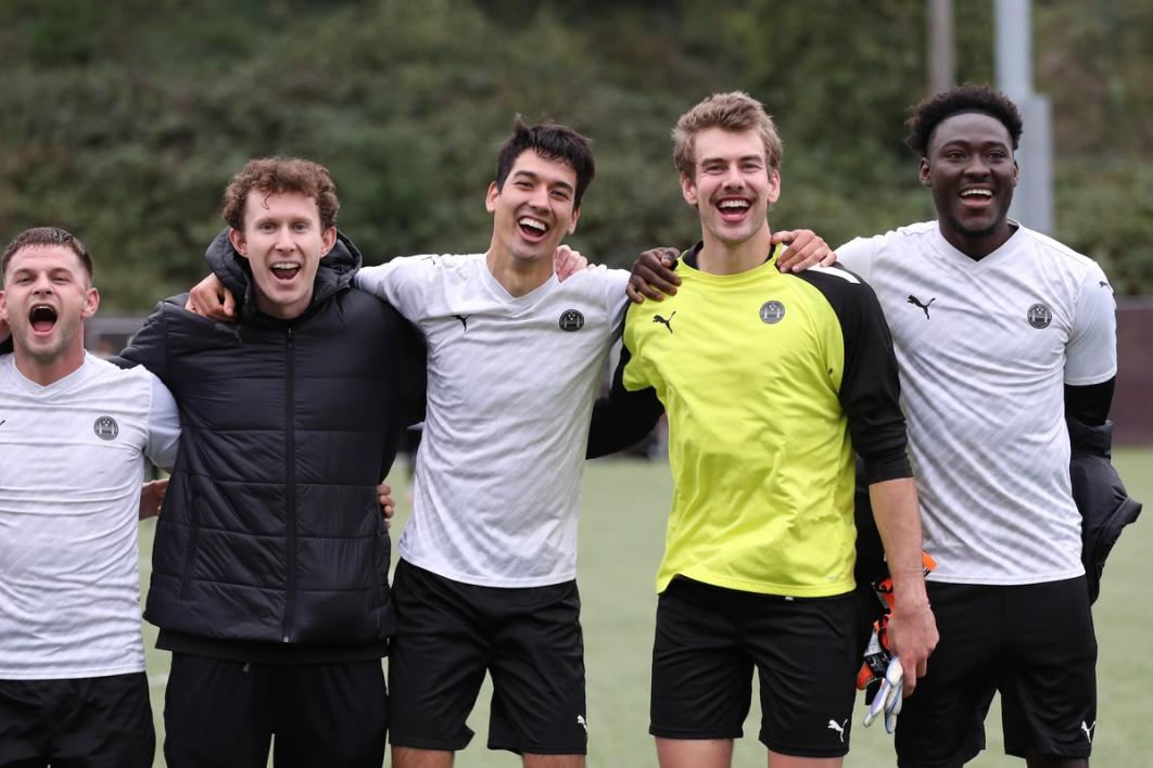 Five participants in the 2025 Open Cup Qualifying Rounds stand on the field