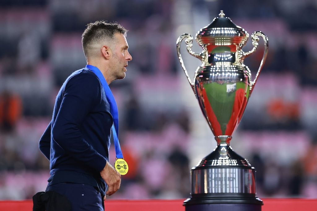 Ben Olsen walks by the Open Cup trophy after his Dynamo won the 2023 edition