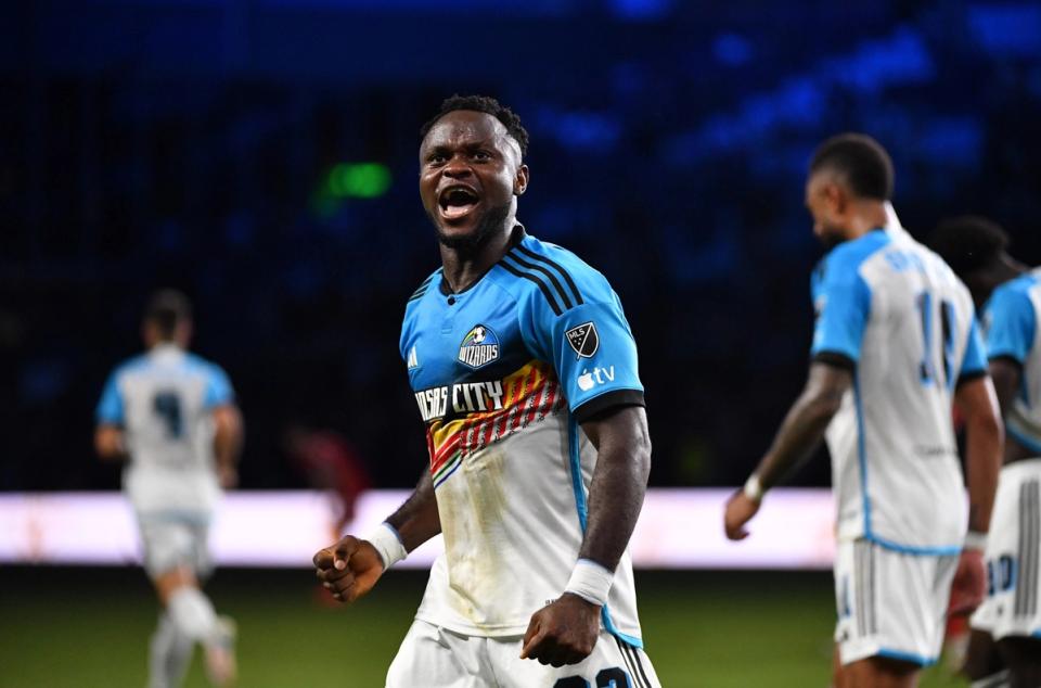 Sporting Kansas City player fist pumps and celebrates