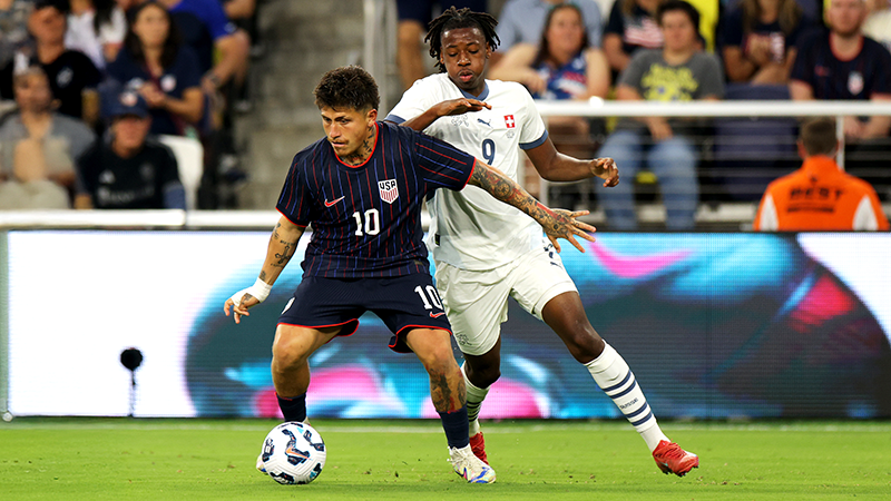 Diego Luna dribbles past defender