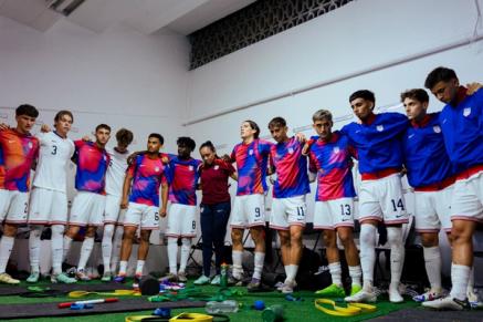 US Mens Youth National Team players huddle up in a locker room