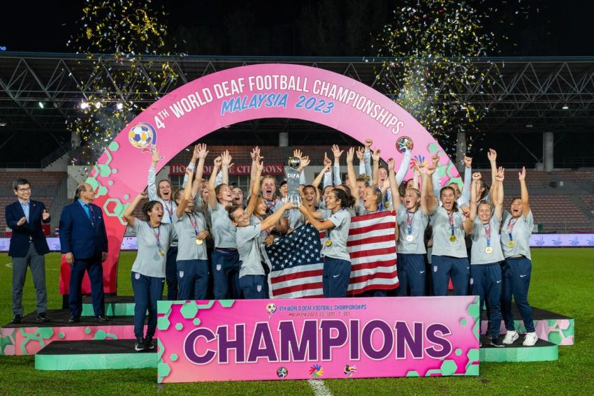 The U.S. Deaf Women's National Team hoists the DIFA World Deaf Football Championship Trophy