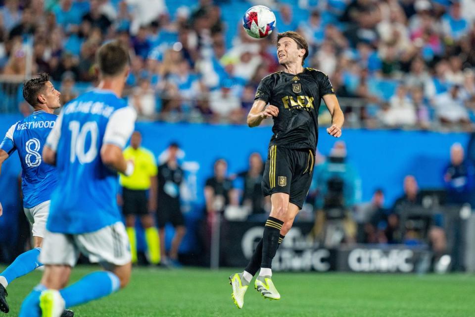 LAFC player goes up for a header