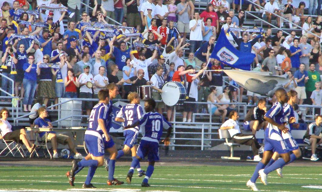 Johnny Menyongar and his Thunder teammates celebrate against RSL in 2005
